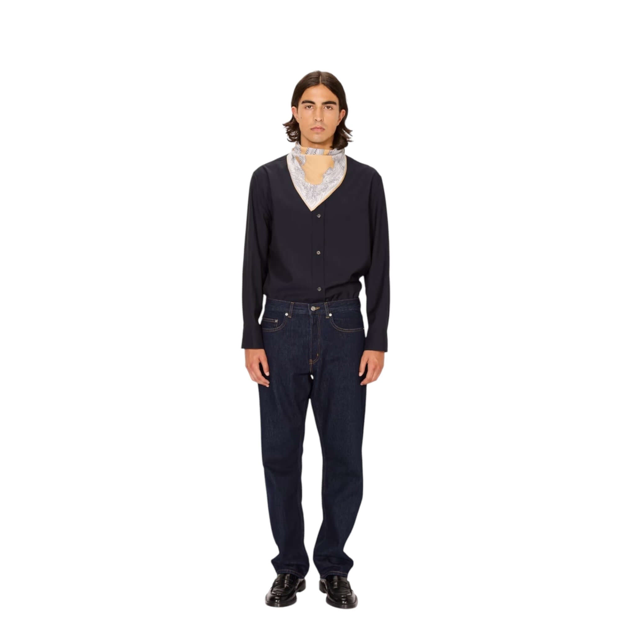 Man wearing a hand-printed Poseidon square foulard styled as a neck accessory with casual attire.