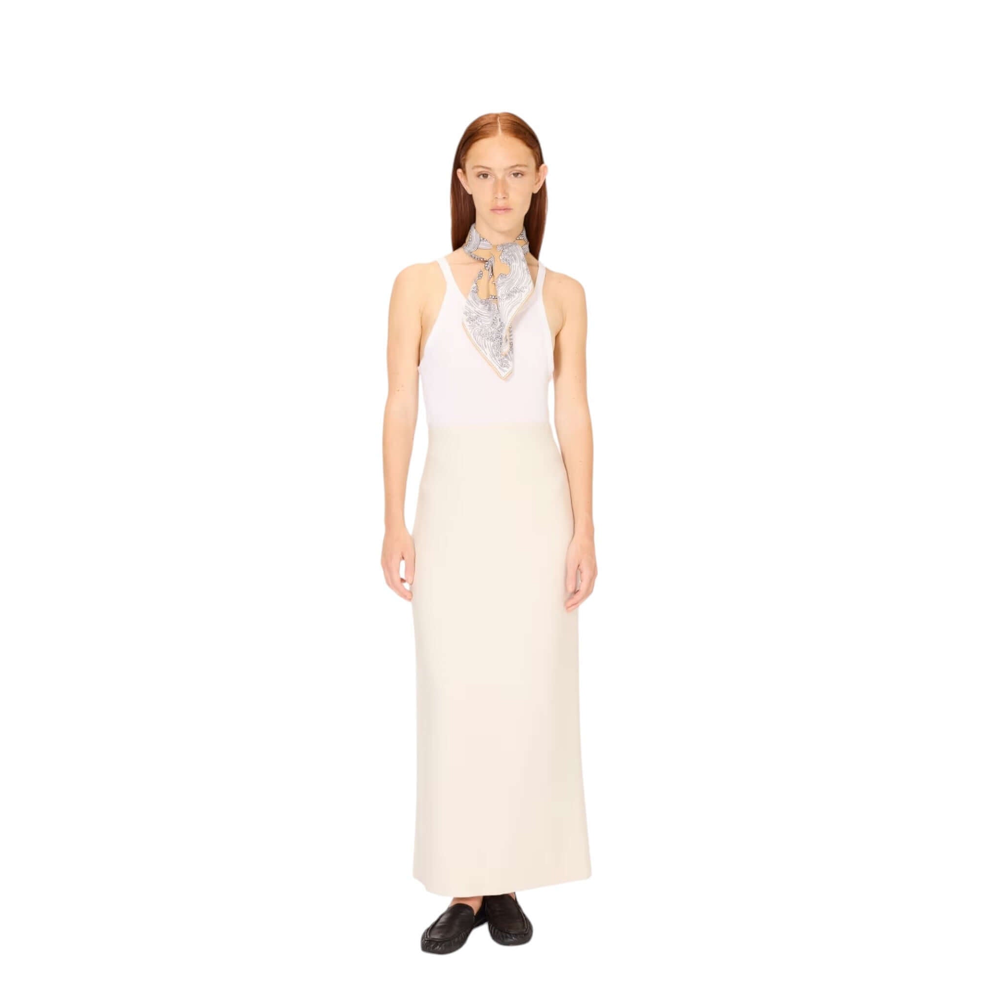 Stylish woman wearing Foulard Quadrato Poseidon scarf with a sleek outfit for a chic look.