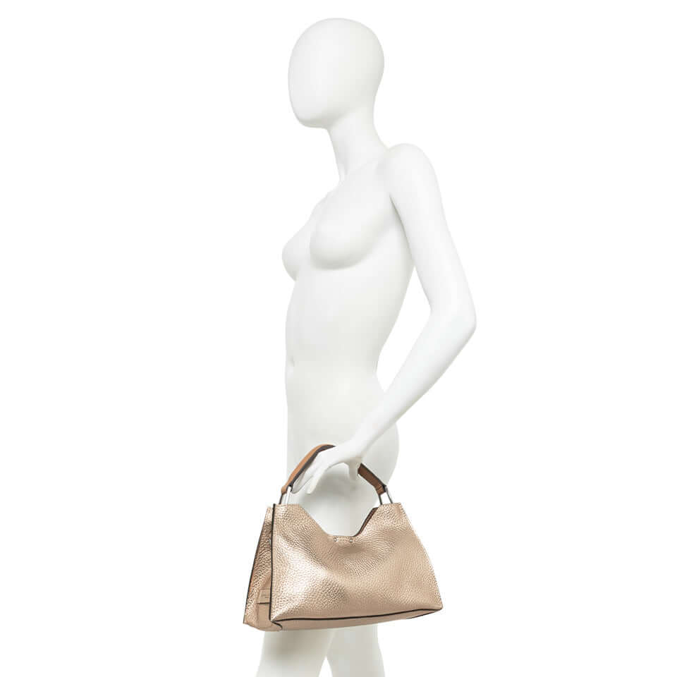 AURORA handbag by Gianni Chiarini, trapezoidal shape, embossed leather, adjustable strap, perfect for contemporary elegance.