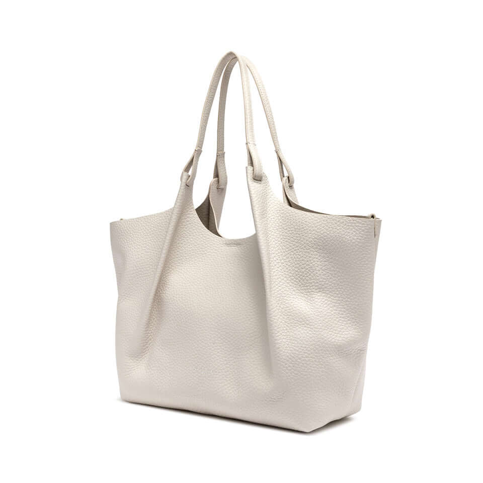 Borsa DUA di Gianni Chiarini in pelle bubble double, colore bianco, con doppio manico e design pratico ed elegante.