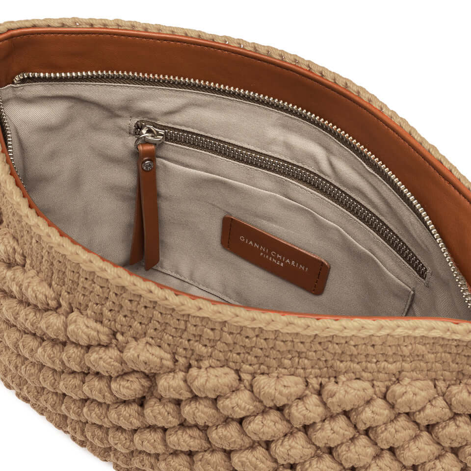 Interior view of Gianni Chiarini Firenze Bella pouch, featuring zip closure and multi-use pocket, artisan-crafted texture.