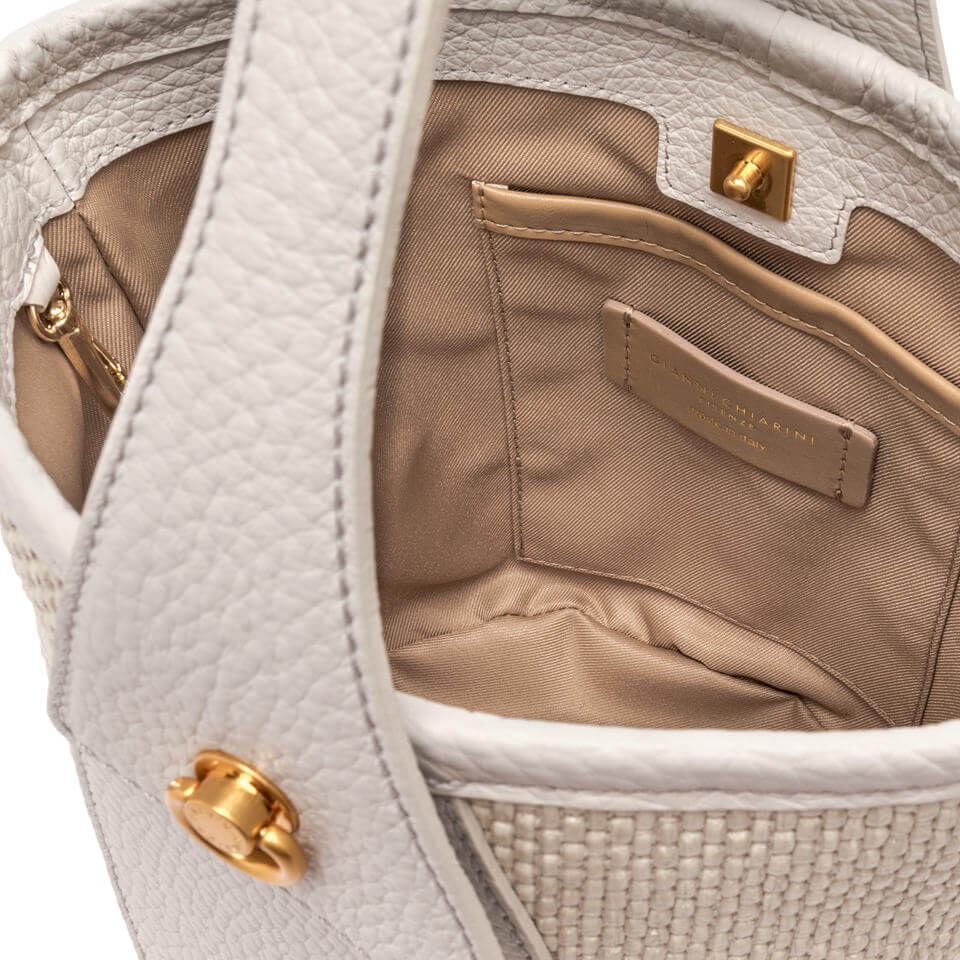 Interior view of Gianni Chiarini Firenze Ester bucket bag, featuring a gold clasp and soft fabric lining.