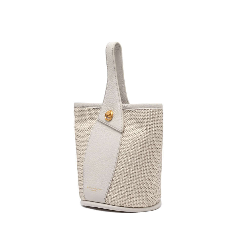 Gianni Chiarini Firenze Ester bucket bag, crafted in woven straw with a decorative ring detail, versatile accessory.