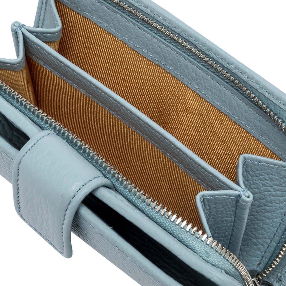 Interior view of Gianni Chiarini Firenze wallet, featuring multiple pockets and soft hammered leather in light blue.