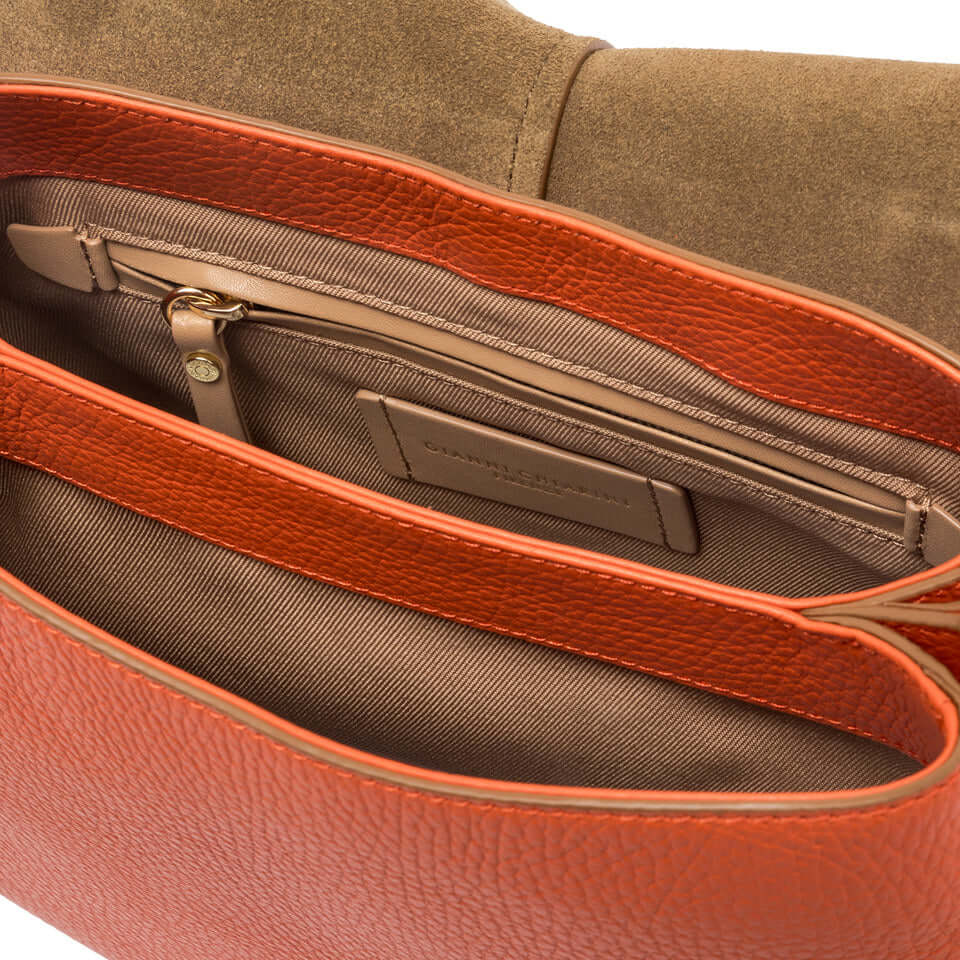 Interior view of the Helena Round bag showcasing its organized compartments and stylish design.