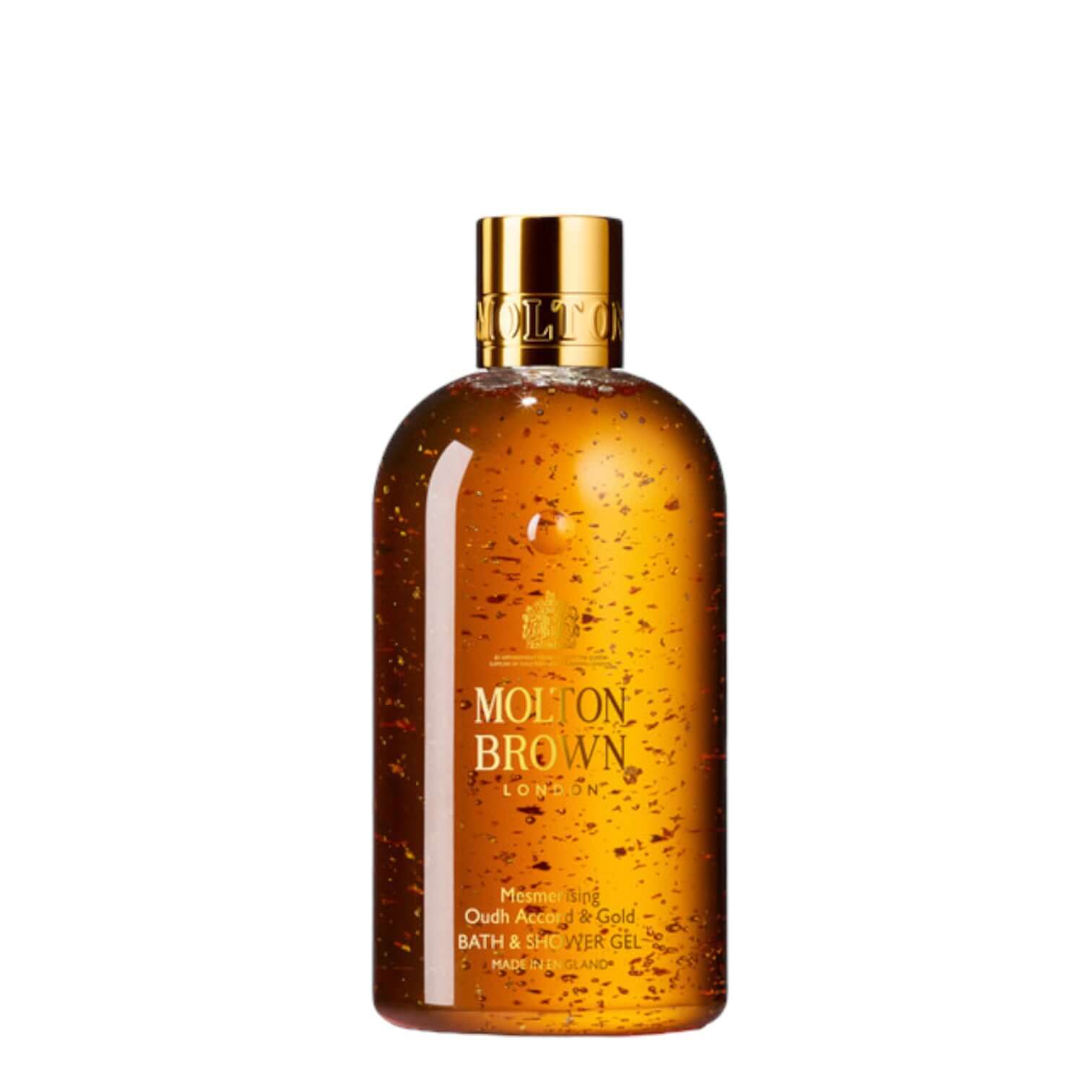 Mesmerising Oudh Accord & Gold shower gel with gold flakes, 300ml by Molton Brown in elegant bottle.