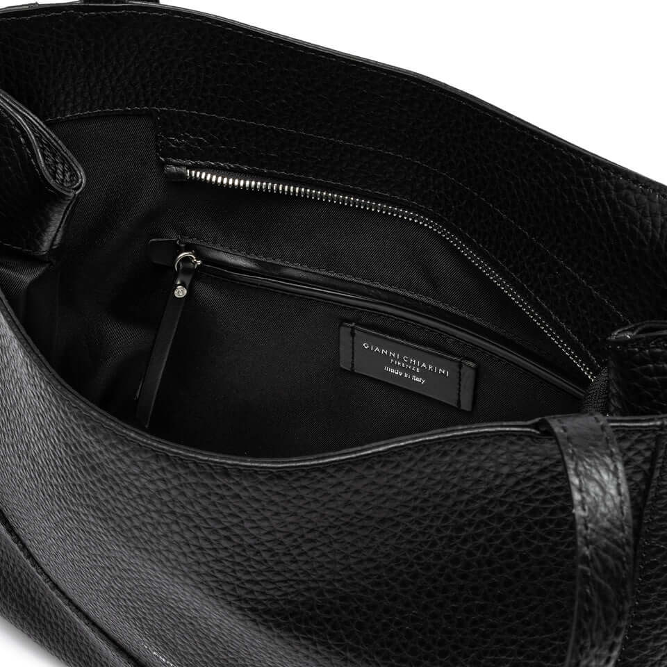 Interior view of Minerva handbag by Gianni Chiarini, showcasing spacious black leather design and zip pocket.