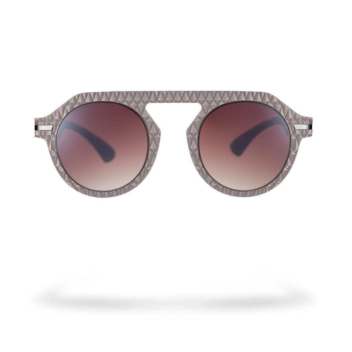 Occhiali da sole MARCO C4 della collezione Flexo, design geometrico con lenti marroni sfumate.