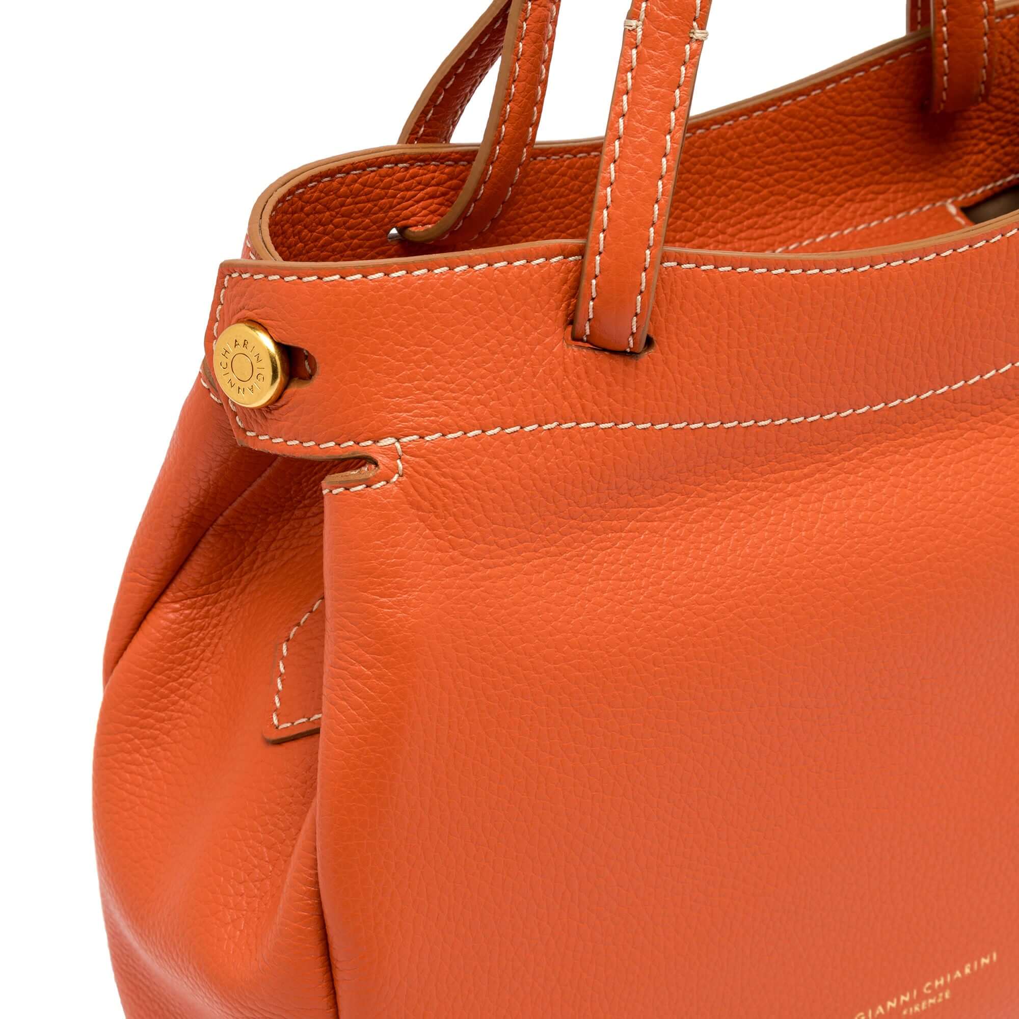 Ottavia Gianni Chiarini Firenze handbag in orange leather with double carry options and logo detail.