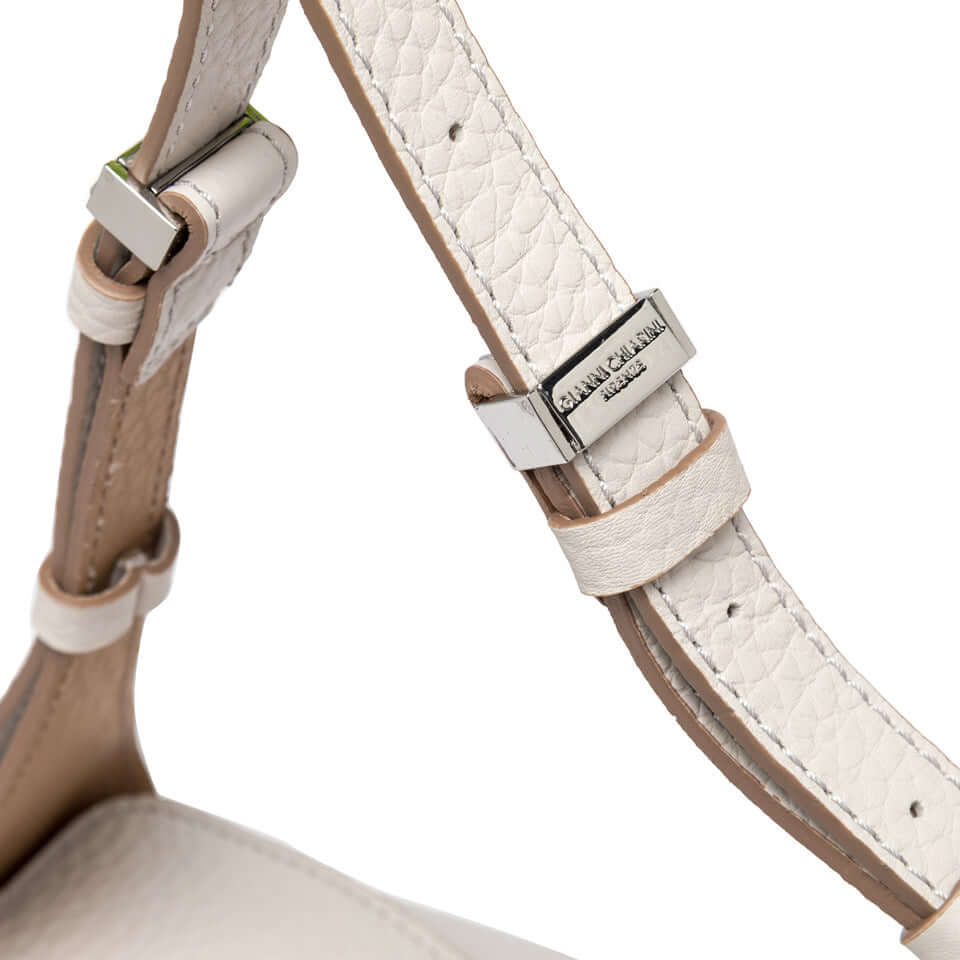 Close-up of the adjustable strap of the Penelope handbag, showcasing its stylish silver hardware and textured leather.