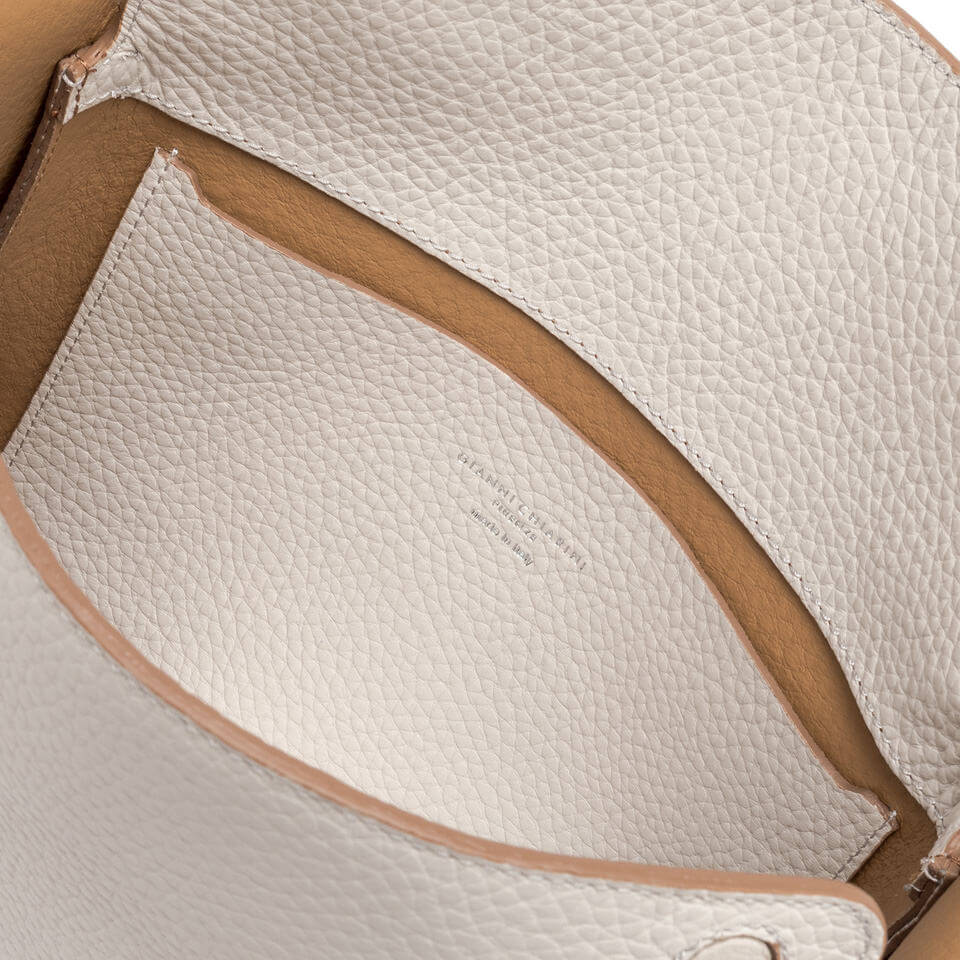 Interior view of Penelope leather handbag showing spacious compartment and textured finish.