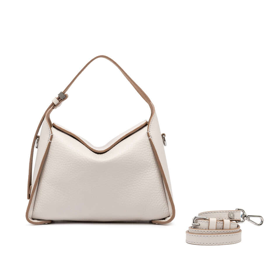 Stylish Penelope bag in soft cream leather with adjustable strap and boxy shape.