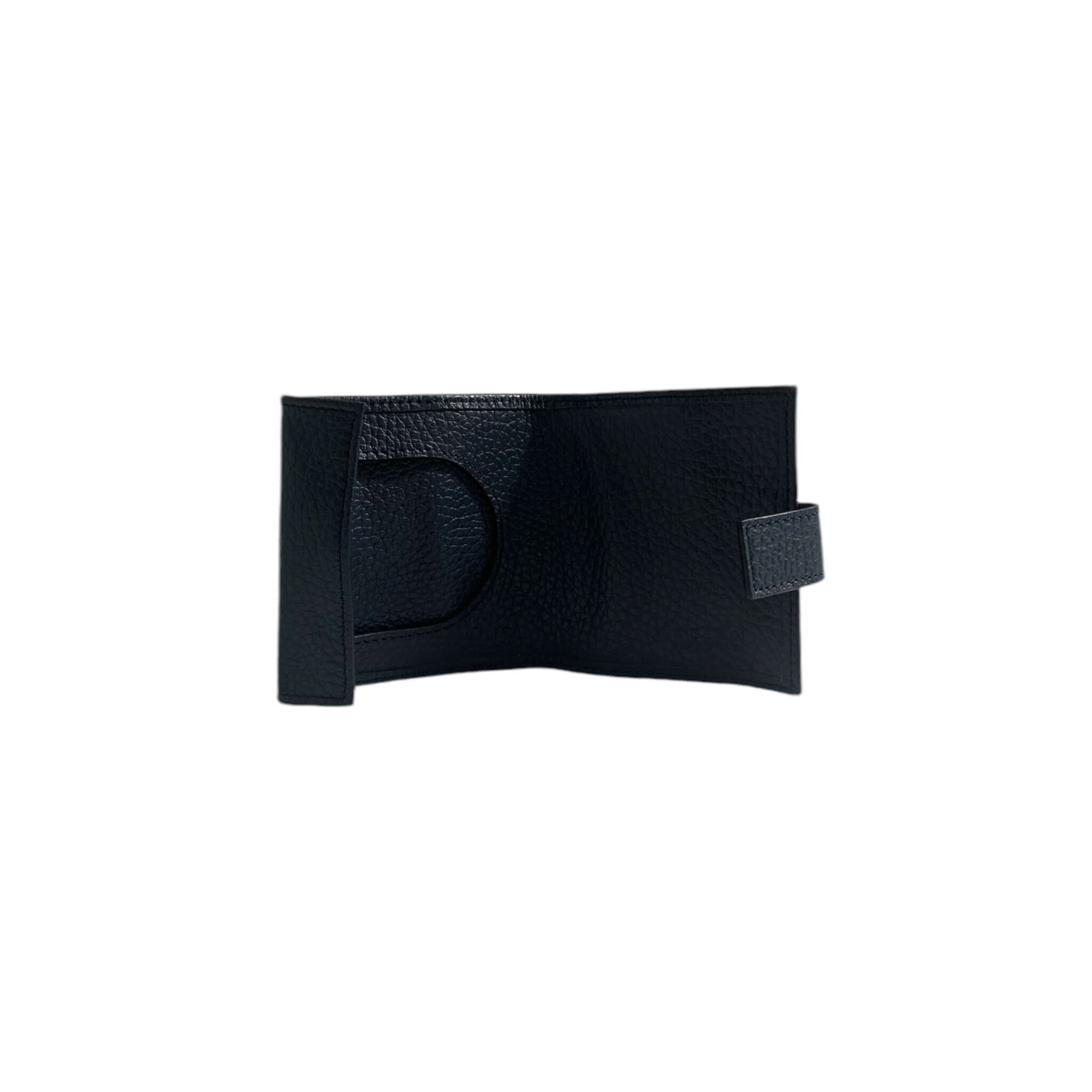 Portamonete Micron in pelle martellata nera, accessorio elegante e pratico per custodire monete.