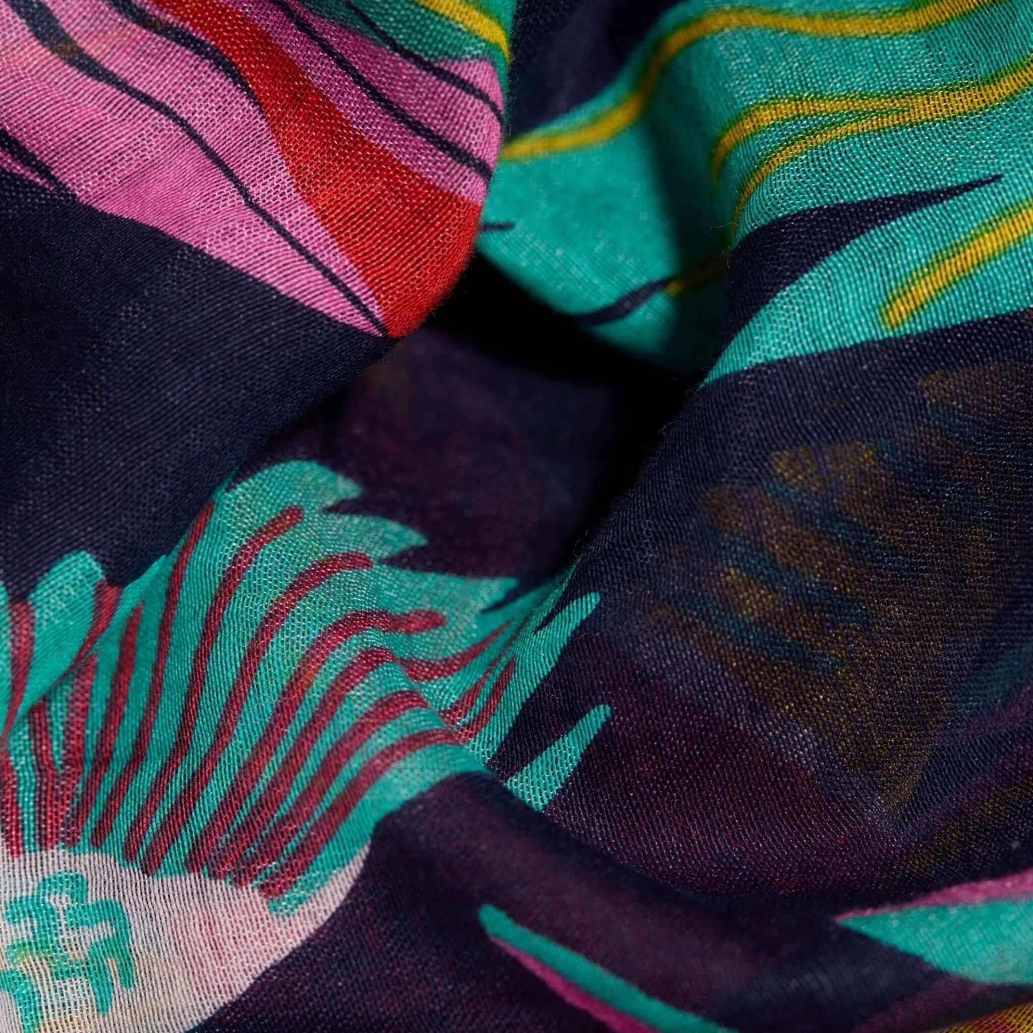Close-up of colorful, hand-printed Rio scarf showcasing intricate patterns and fine textures.