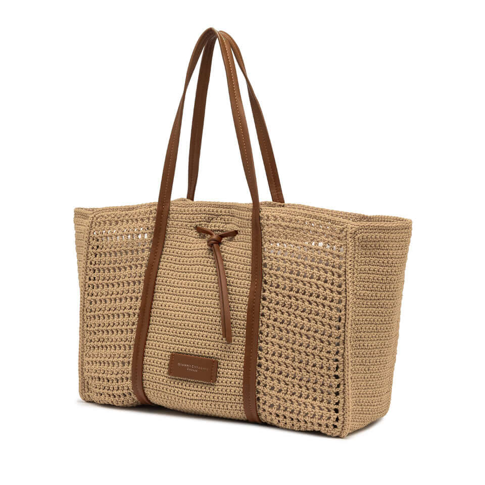 Victoria shopping bag in crochet fabric, featuring leather details and clean lines, perfect for stylish beach outings.