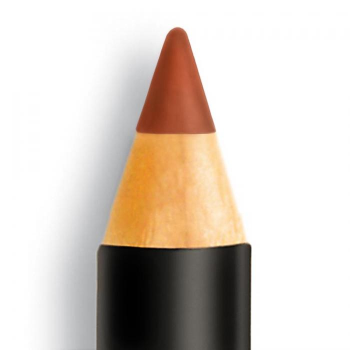 Close-up of a rust lip pencil tip featuring a natural shade ideal for bronzed or dark skin tones.