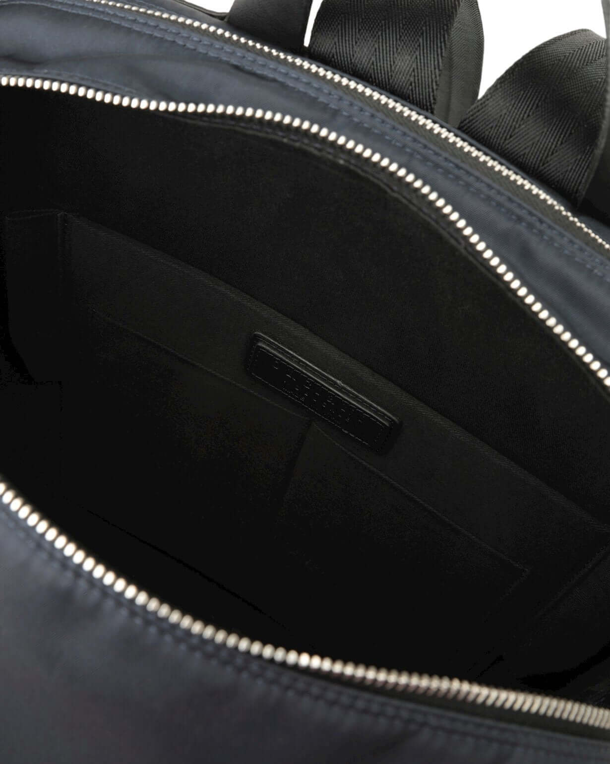 Interior view of Zaino Nobuckle Planet Eco-Logic, featuring eco-nylon fabric and multiple compartments for organization.