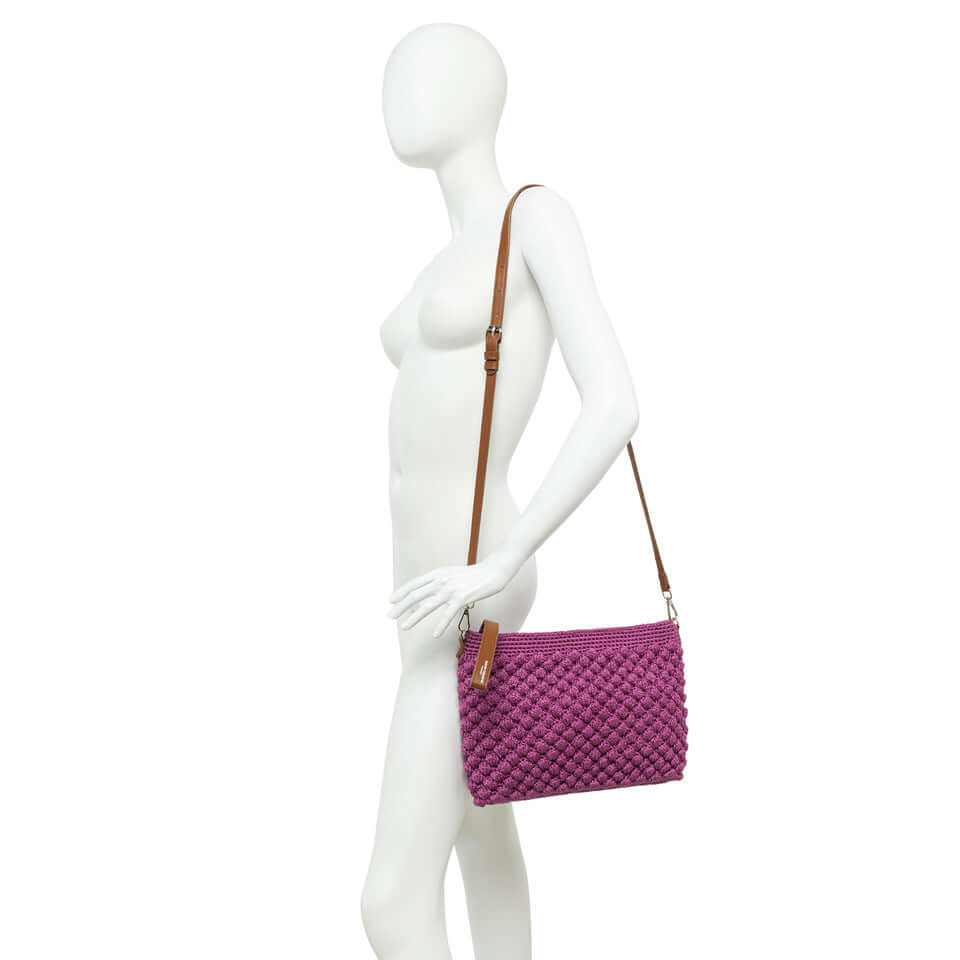 BELLA by Gianni Chiarini Firenze, stylish purple pouch bag with bubble texture and adjustable strap.
