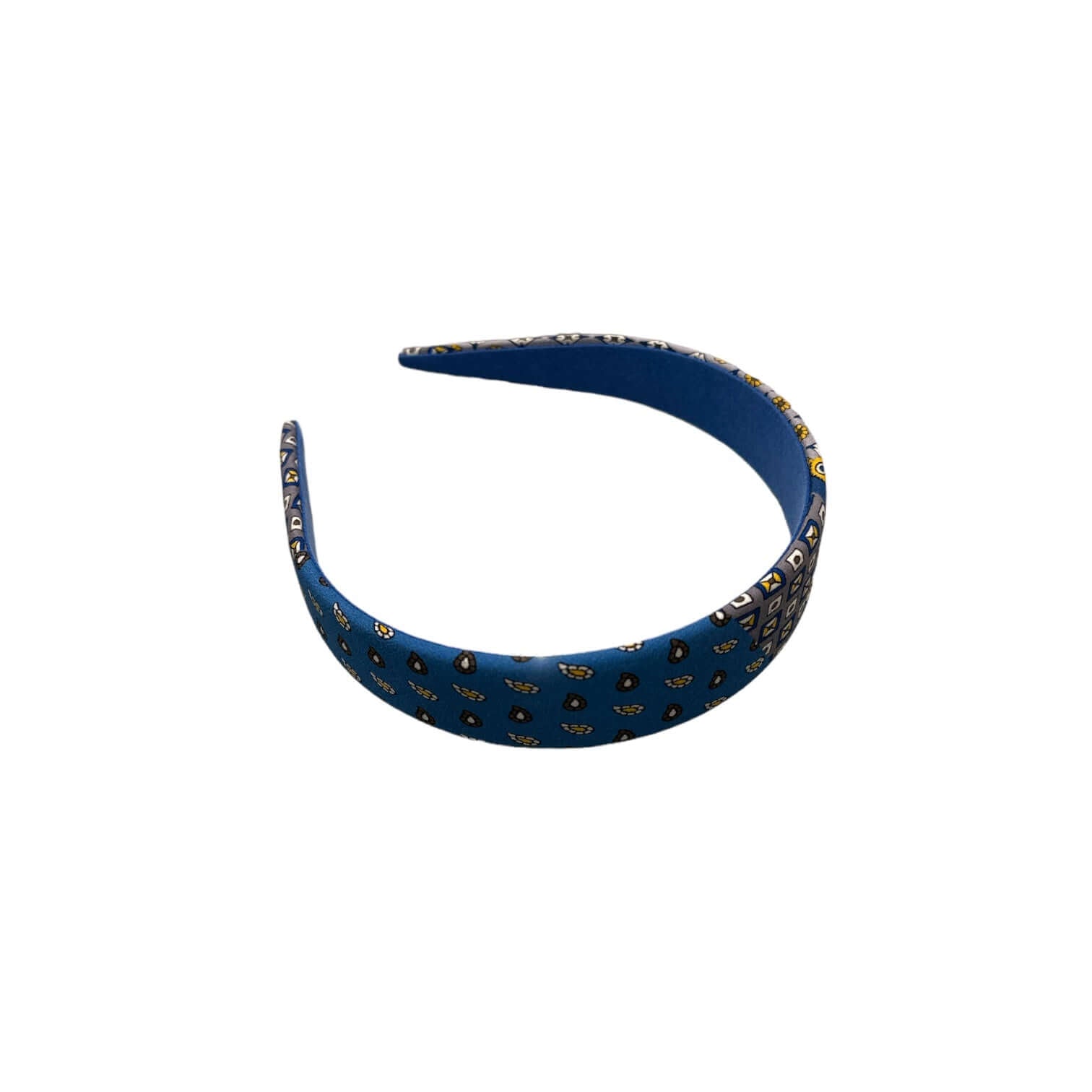 Cerchietto largo piatto in seta blu con disegni eleganti, perfetto per un look ordinato e raffinato.