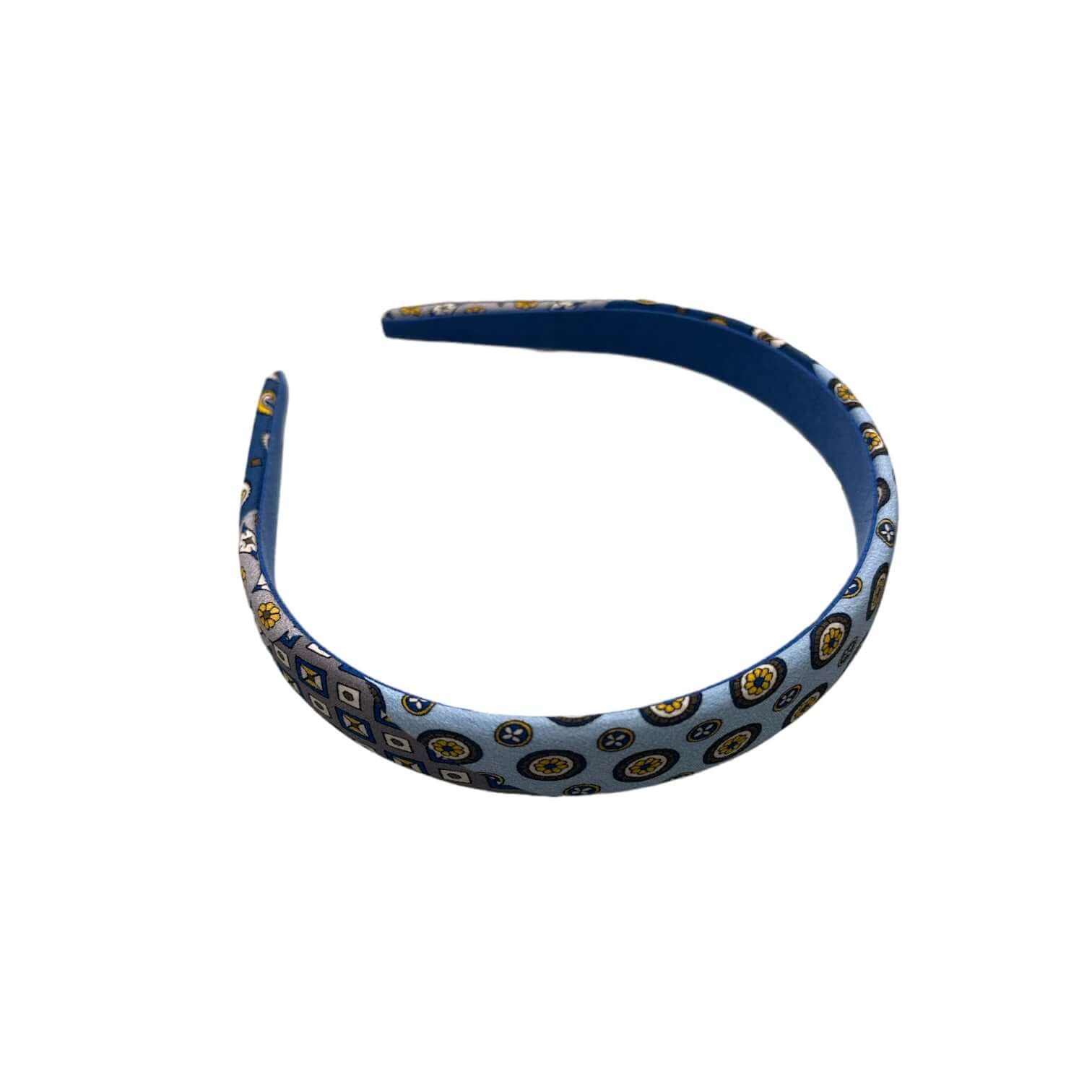 Cerchietto Medio Piatto blu con motivi circolari, realizzato in 90% seta per un look elegante e raffinato.