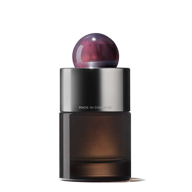 Elegant Fiery Pink Pepper Eau De Parfum bottle with unique resin cap, showcasing a blend of spice and wood notes.