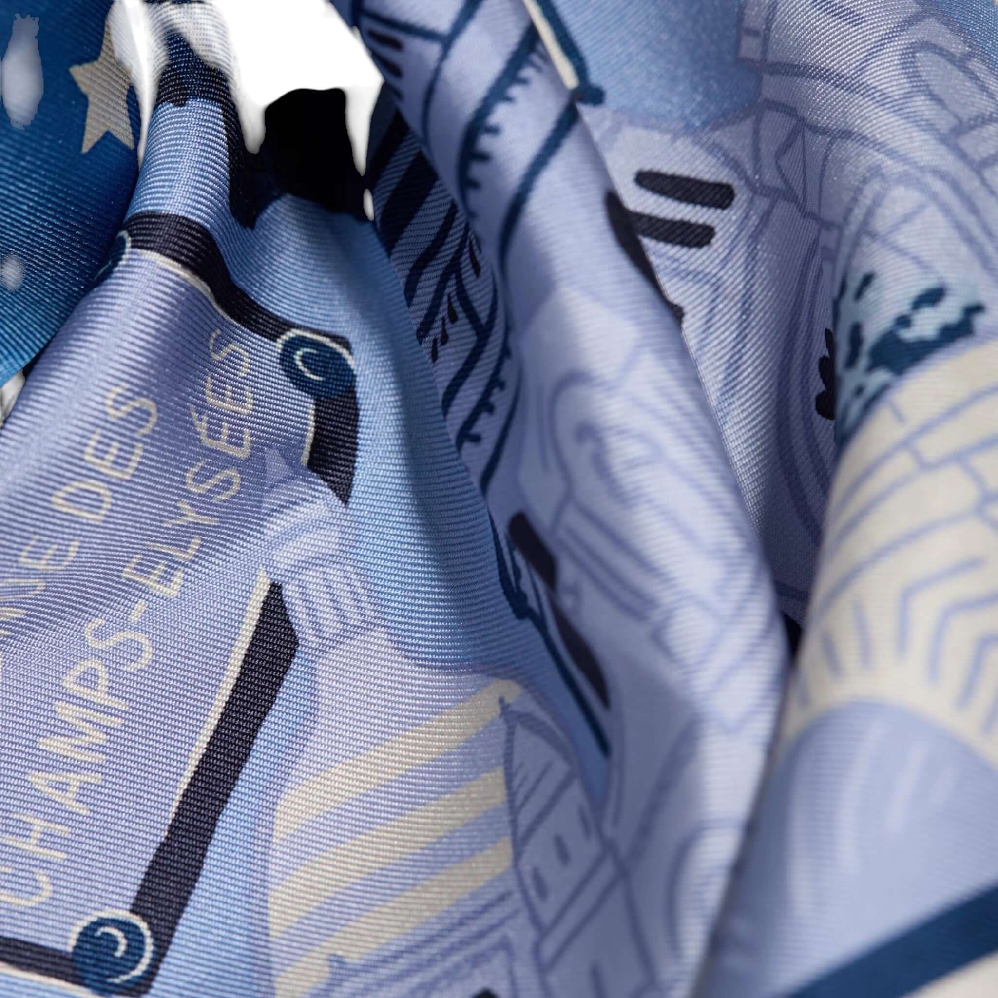 Foulard Quadrato J'aime Paris in blue tones, featuring iconic Parisian landmarks and designs, made of silk.