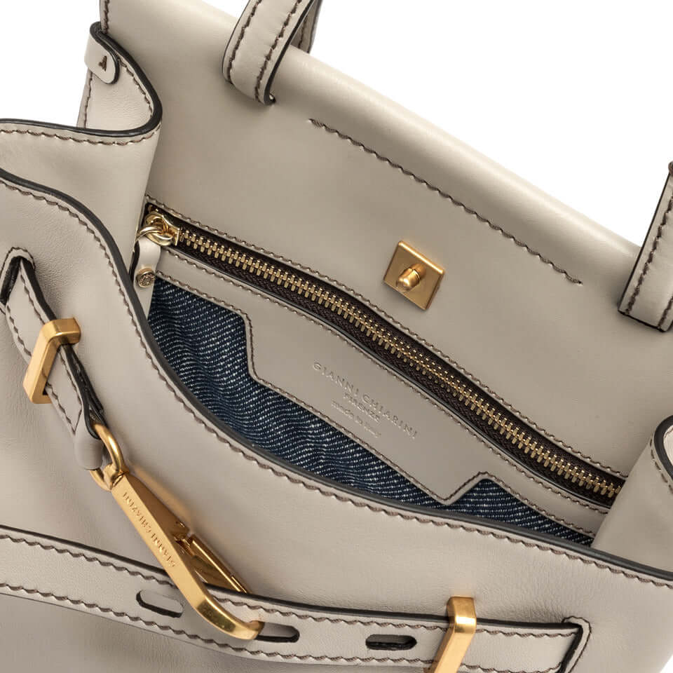 TILDA handbag by Gianni Chiarini Firenze, showing elegant interior with gold zipper and logo detail.