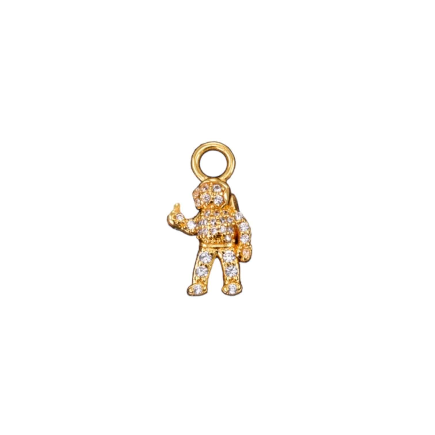 Malin Charm, gold-plated astronaut pendant in brass, adorned with sparkling stones, perfect for personalized jewelry.
