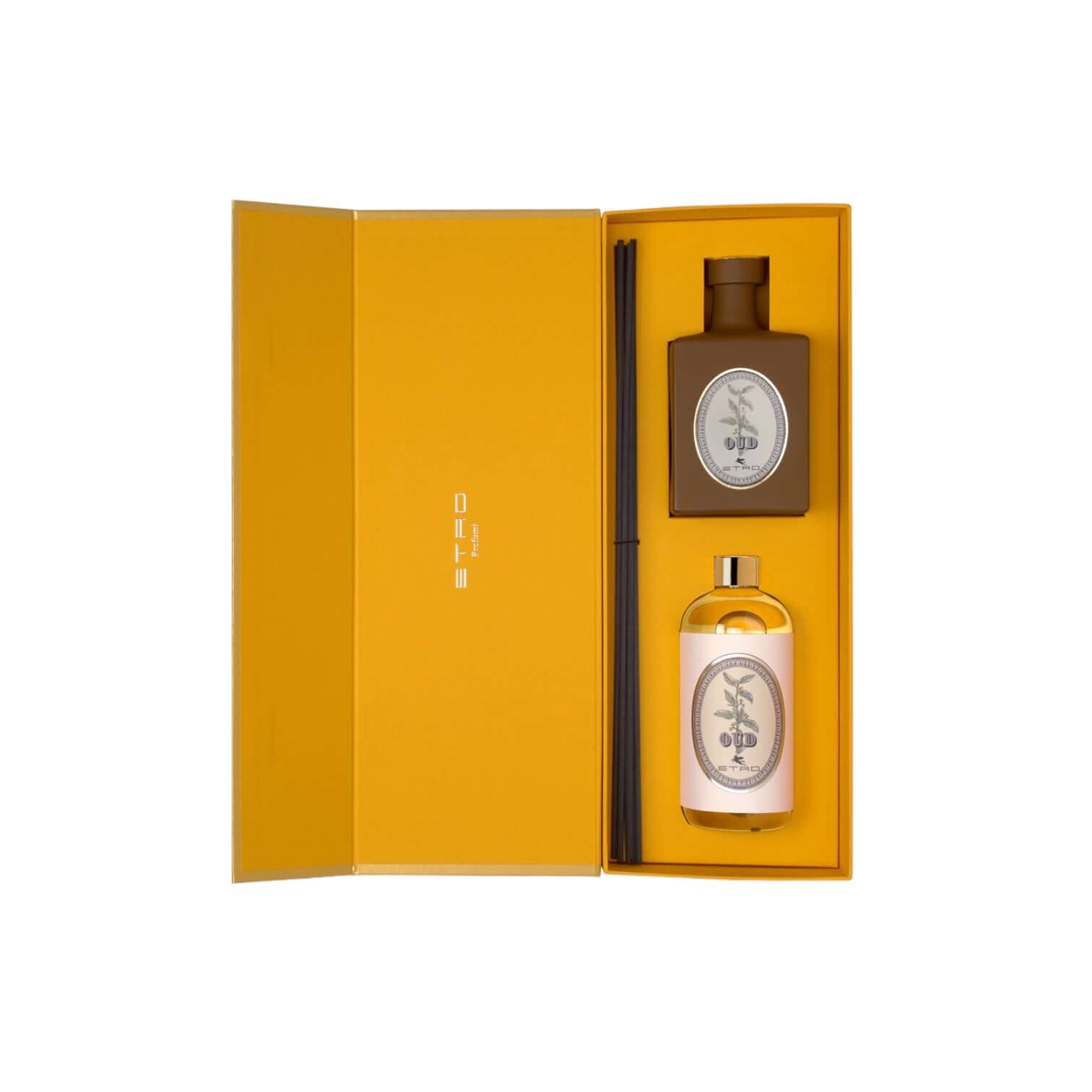 Elegante diffusore Oud in scatola ETRO con flacone marrone e refill 500ml, decorato con midollini neri.