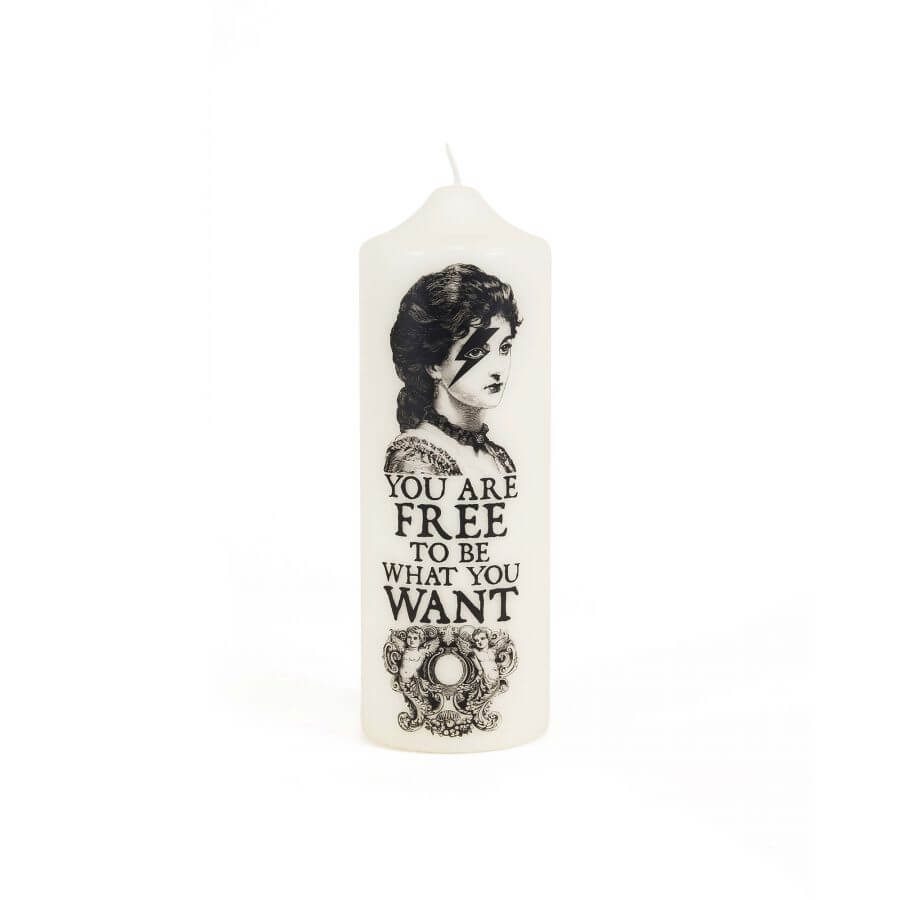 Visionary pillar candle with message 'You Are Free to Be What You Want', featuring artistic black and white design.