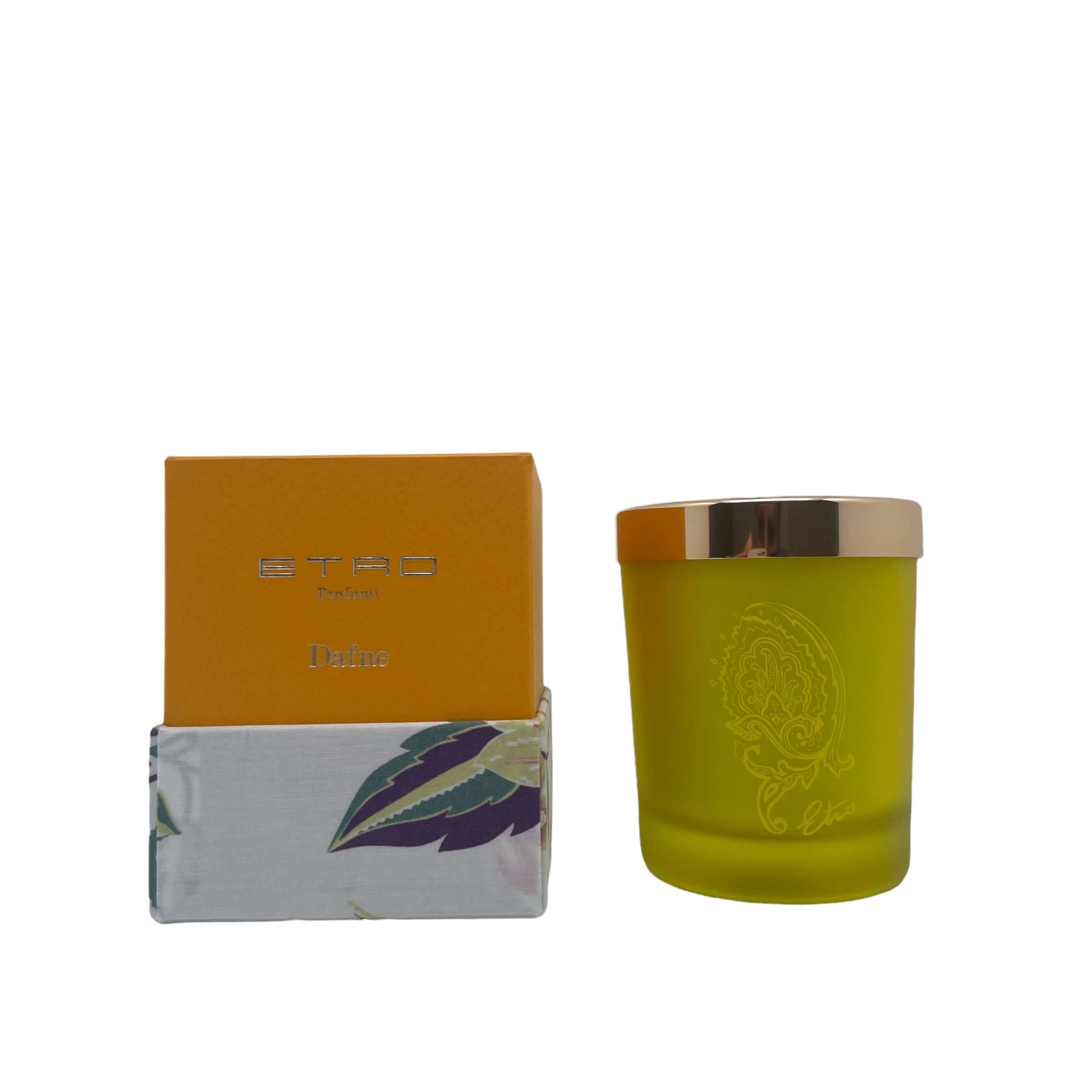 Dafne Candela by ETRO in a yellow glass holder with a gold lid and box, featuring elegant design and Dafne fragrance.