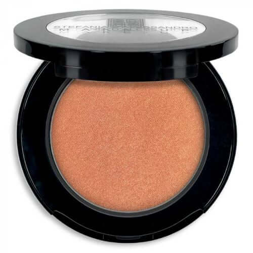 Terra Bronzer product in black compact, a pearlescent bronzer for face and body, enhances tan and warmth.
