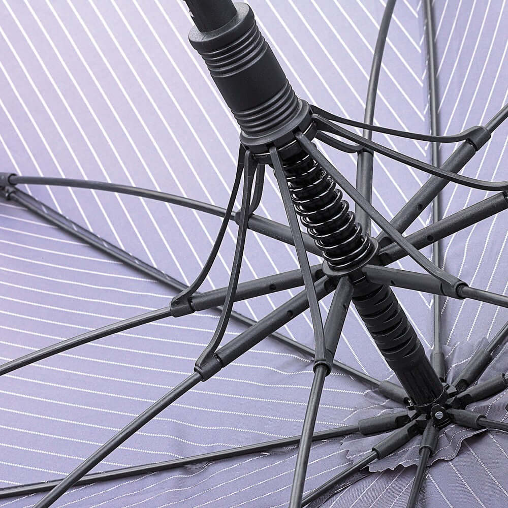 Close-up of the Ombrello Black Steel umbrella's structure with flexible fiberglass ribs and a sturdy design.