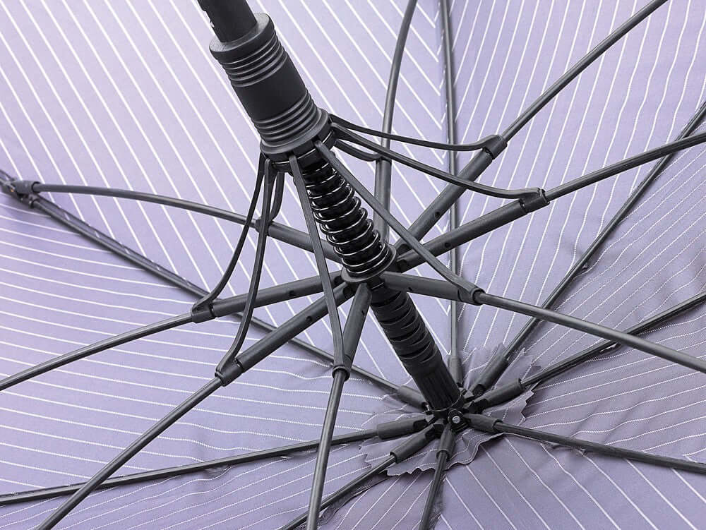 Detail of the interior structure of the Ombrello City Stripe Navy umbrella, featuring a durable fiberglass frame and spring mechanism.